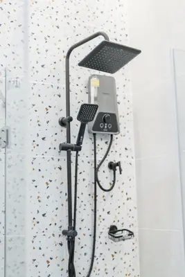 a shower with a light on the wall of a bathroom at Harley 1 BDR Condo Kata Hill, 3 Mins To kata Beach in Kata Beach