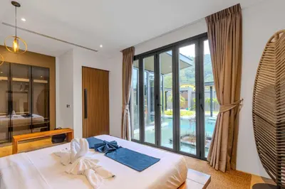 a bedroom with a bed and a large window at V263 Brand New 3BR Super Modern Pool Villa - Calathea in Thalang