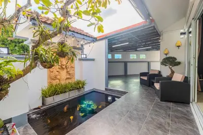 an indoor koi pond in the middle of a building at V267 Newly Renovated 2BR with Pool Near Beaches in Ban Saiyuan (1)