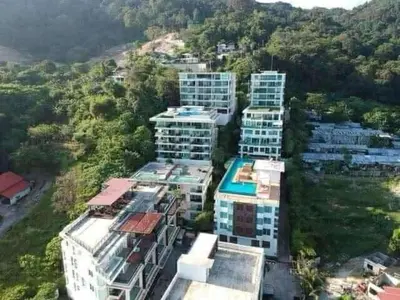 an aerial view of tall buildings in a city at The Privilege by Tris in Patong Beach