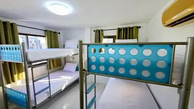 a bunk bed room with two bunk beds in it at MT Friend Hostel Phuket Town in Phuket Town