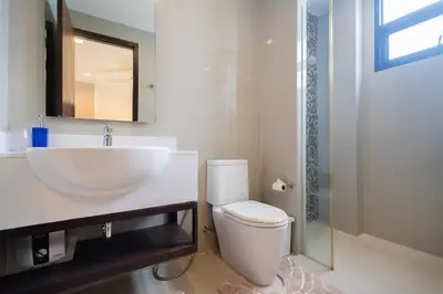 a bathroom with a sink and a toilet and a shower at Luxury 5 bedroom villa Laguna Park in Laguna Phuket