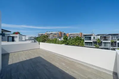 a view from the roof of a house with a balcony at Luxury 5 bedroom villa Laguna Park in Laguna Phuket