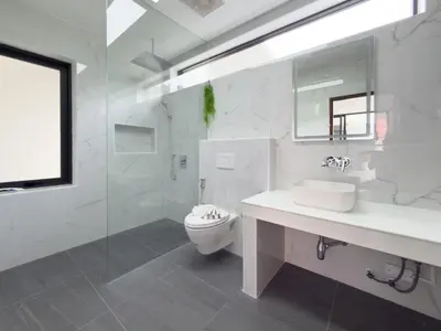 a white bathroom with a sink and a toilet at Stylish 3BR Pool Villa Lawan Villa (LWV1) in Phuket Town