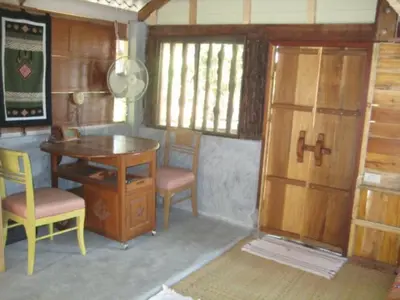 a rendering of a room with a table and chairs at Lanlay Home Stay Krabi in Ao Luk