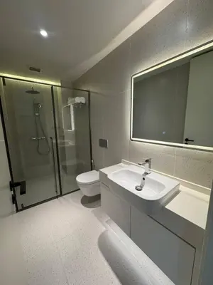 a bathroom with a sink and a shower and a toilet at Sunshine Beach, Kora Resort Phuket 5, Bang Tao, Laguna in Bang Tao Beach