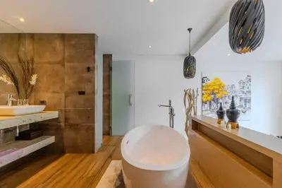 a bathroom with a large tub and a sink at 2BR Modern Pool Villa Near the Sea V261 in Thalang