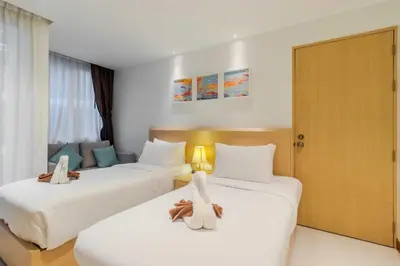 two beds in a hotel room with stuffed animals on them at C245 Steps from the Beach Pool & Ocean View in Ban Saiyuan (1)