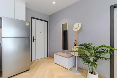 a room with a refrigerator and a plant in it at C249 Brand new Pool view stay with great amenity in Bang Tao Beach
