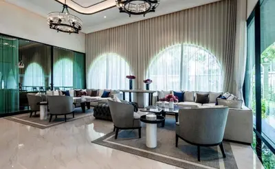 a lobby with couches and tables and windows at C250 Brand new Stay near top beach & Boat Avenue in Thalang