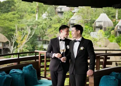 two men in tuxedos standing next to each other at Keemala - Clay Pool Cottage in Kamala Beach