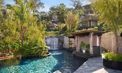 a pool in the middle of a yard with trees at Keemala - Tree Pool House in Kamala Beach