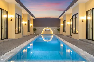a swimming pool in the middle of a house at Amaleena Pool Access Suites in Ban Bang Chak