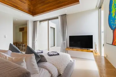 a living room with a bed and a tv at V271 Smart Villa Full Amenities Best Stay Escape in Thalang