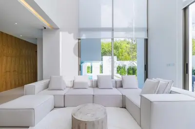 a living room with a white couch and a table at V271 Smart Villa Full Amenities Best Stay Escape in Thalang