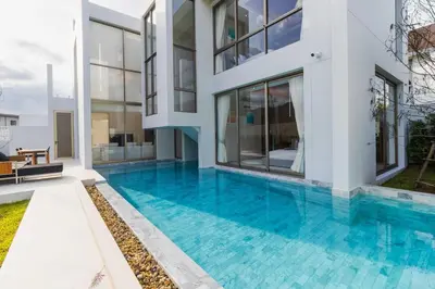 a swimming pool in the backyard of a house at V271 Smart Villa Full Amenities Best Stay Escape in Thalang