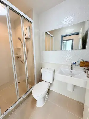 a bathroom with a toilet and a sink and a shower at The closest accommodation next too central Mall in Ban Rangeng