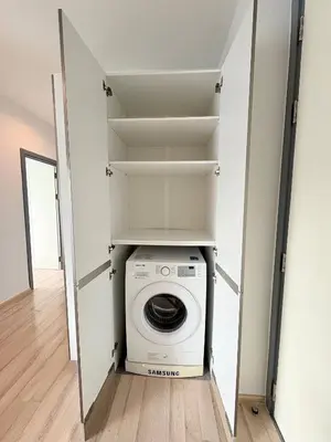 a laundry room with a washer and dryer at The closest accommodation next too central Mall in Ban Rangeng