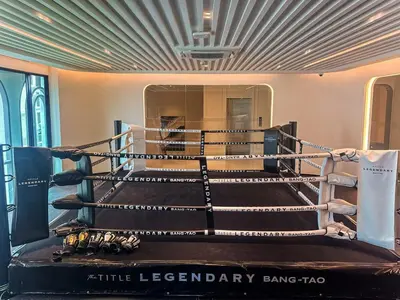 a boxing ring with boxing gloves in a room at Amazing 1Bdr Title Legendary Bang Tao in Bang Tao Beach