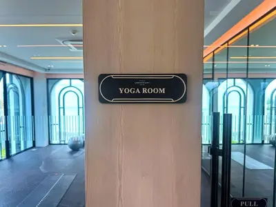 a sign for a yoga room on the side of a wall at Amazing 1Bdr Title Legendary Bang Tao in Bang Tao Beach