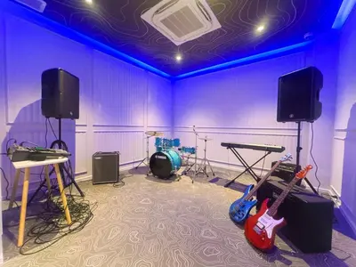 a room with two guitars in a recording studio at Amazing 1Bdr Title Legendary Bang Tao in Bang Tao Beach