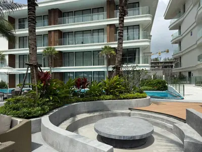 a fountain in front of a building at Sunshine BEACH FRONT in Layan Beach