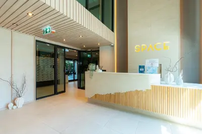 a lobby of a store with a counter in a building at 1BR near Laguna, Space Cherngtalay, Bangtao beach by Pat in Ban Thalat Choeng Thale