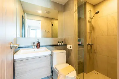 a bathroom with a toilet and a sink and a shower at 1BR near Laguna, Space Cherngtalay, Bangtao beach by Pat in Ban Thalat Choeng Thale