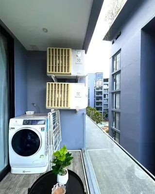a washing machine sitting on top of a balcony at The Kamala View in Kamala Beach