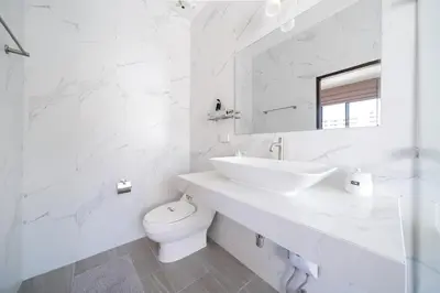 a white bathroom with a sink and a toilet at Holistic Haven Private Pool Villa at Kamala Newest Residence in Kamala Beach