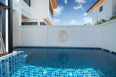 a swimming pool in the middle of a house at Holistic Haven Private Pool Villa at Kamala Newest Residence in Kamala Beach
