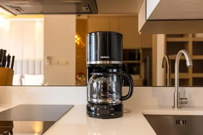 a coffeemaker sitting on a counter in a kitchen at Suite Ostia with Gym Pool Access-Bellevue Lagoon in Laguna Phuket