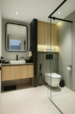 a bathroom with a toilet and a sink and a mirror at Layan Green Park Studio by Search Estate in Phuket