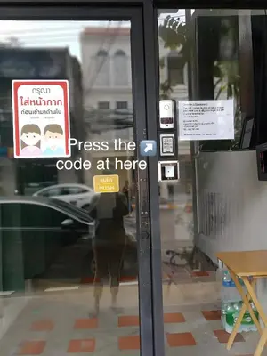 a door with a sign that says stress the code at here at XX GO INN Phuket City - โกอินน์ ภูเก็ต โอลทาวน์ Old Town in Phuket Town