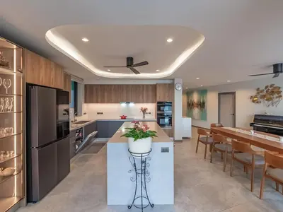 a kitchen with a large island and a dining room at Lakeside 5-BR New Pool Villa in Gated Community in Chalong