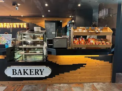 a bakery with a bakery counter with a bakeryacist at Popular Kamala City Gate 1 bdr 3 Pools in Kamala Beach