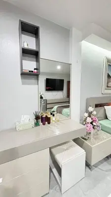 a white room with a desk and a bed at Family House Patong - Homestay in Patong Beach