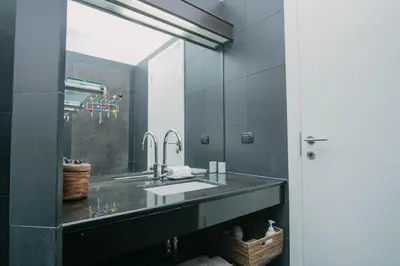 a bathroom with a sink and a mirror at Luxury Pool Villa a Short Walk from Bangtao Beach in Bang Tao Beach