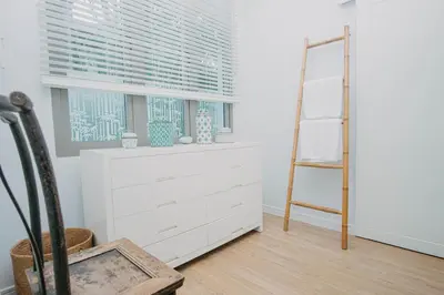 a room with a dresser and a ladder and a window at Luxury Pool Villa a Short Walk from Bangtao Beach in Bang Tao Beach
