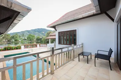 a balcony of a house with a swimming pool at 2,5BR Tropical Lakeview Villa I Bangtao Beach in Surin Beach