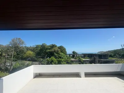 a view from the balcony of a house at Cozy Siray Phuket 3-Floor Seaview Family Home in Ban Lo Ti Pa (1)