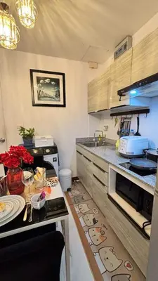 a kitchen with a table with a counter top at 209 Patong loft condominium in Patong Beach