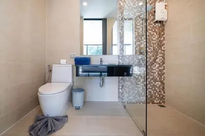 a bathroom with a toilet and a sink and a shower at 3-Story Pool Villa Near Kata Beach - UTK 4 in Kata Beach