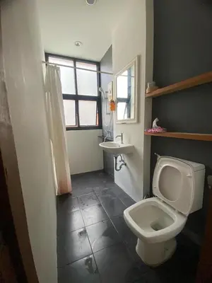 a bathroom with a toilet and a sink at Arch Club in Patong Beach
