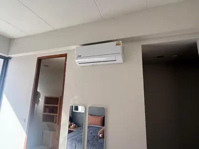 a room with a air conditioner on the wall at Arch Club in Patong Beach