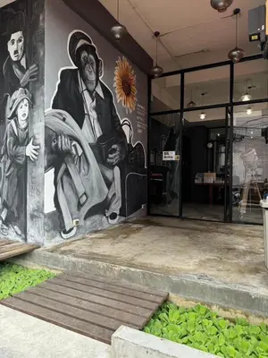 a mural on the side of a building at Arch Club in Patong Beach