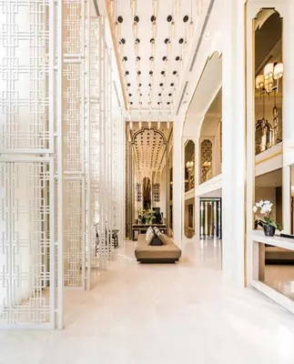 a lobby of a building with a large glass wall at Elegant Stay with 360 degree Panoramic Rooftop Pool in Ban Sam Kong