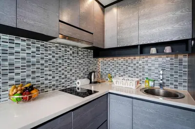 a kitchen with a sink and a bowl of fruit at Modern Residence Tropics CTG-L709 with Medical and Wellness Center in Kamala Beach
