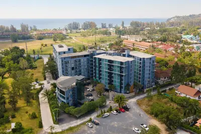 an overhead view of a building with a parking lot at Modern Residence Tropics CTG-L709 with Medical and Wellness Center in Kamala Beach