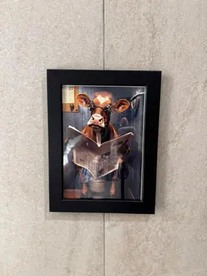 a picture of a cow hanging on a wall at Villa Maria Luxury in Kamala Beach